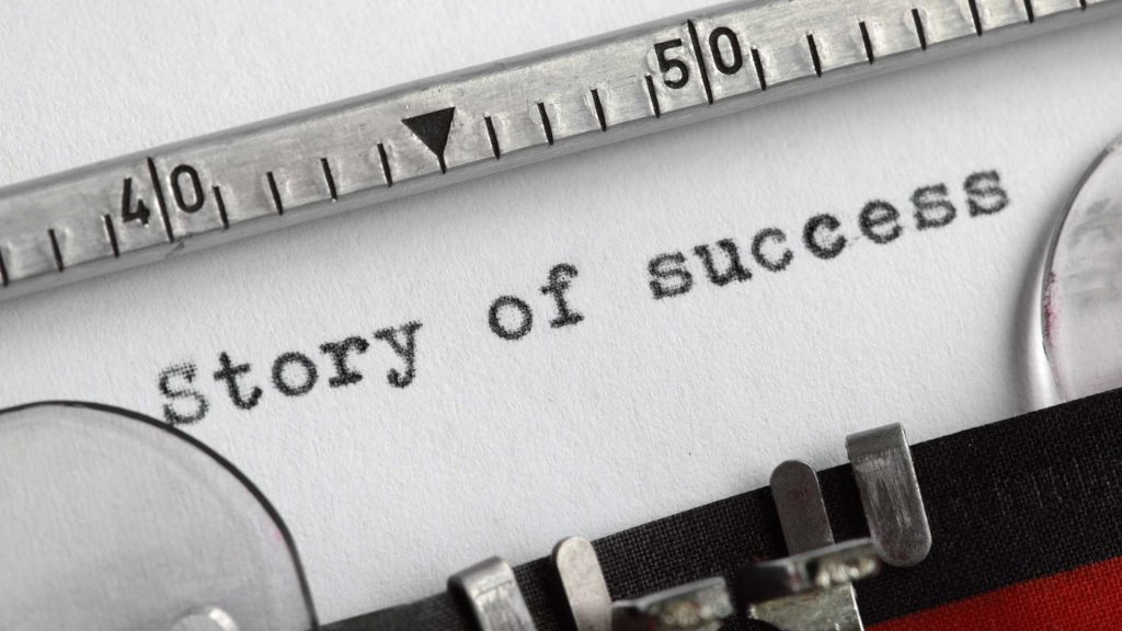 Image of "Story of Success" written by a typewriter.